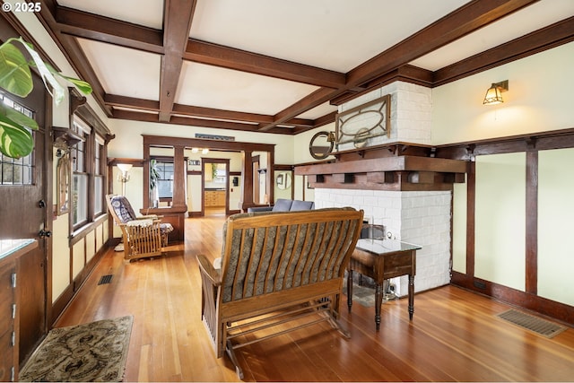 155 S 8th St, Saint Helens, OR 97051 - living area with hardwood / wood-style floors, baseboards, beamed ceiling, visible vents, and coffered ceiling