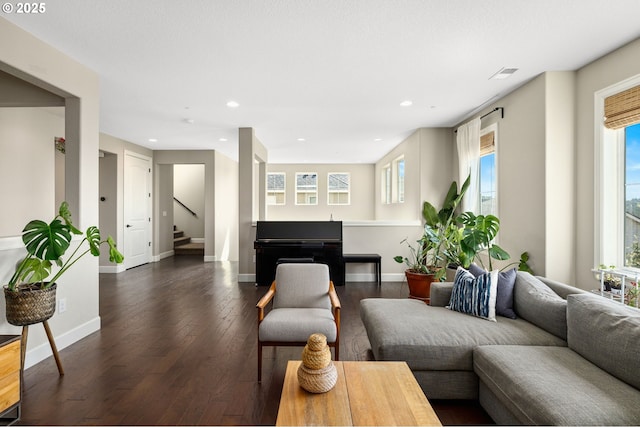 living area with stairway, baseboards, dark wood-type flooring, and recessed lighting