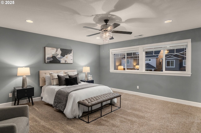 carpeted bedroom with ceiling fan