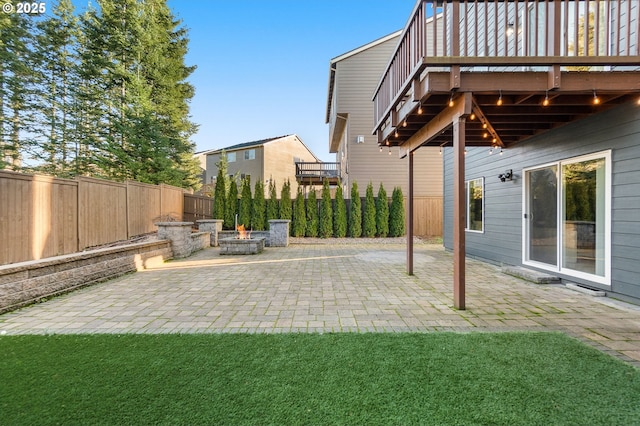 view of yard with a fire pit and a patio area