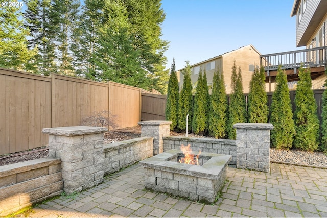 view of patio featuring a fire pit