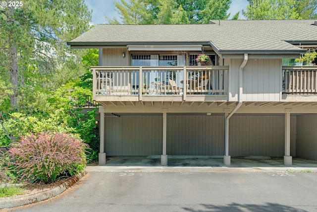 7508 SW Barnes Rd Unit A, Portland, OR 97225 - townhome / multi-family property featuring a shingled roof and covered parking