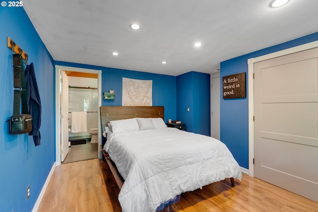 7508 SW Barnes Rd Unit A, Portland, OR 97225 - bedroom featuring recessed lighting, wood finished floors, and ensuite bath