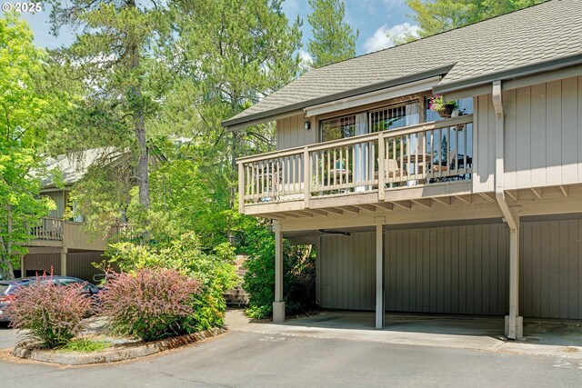 7508 SW Barnes Rd Unit A, Portland, OR 97225 - view of front facade featuring covered parking and a balcony