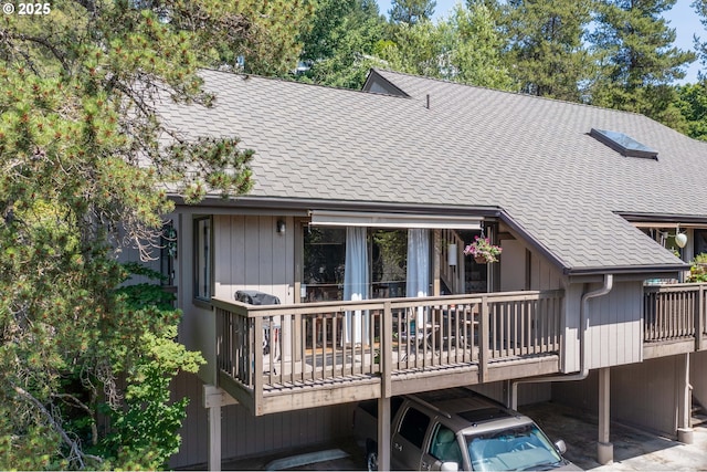 7508 SW Barnes Rd Unit A, Portland, OR 97225 - rear view of house with a deck and a shingled roof