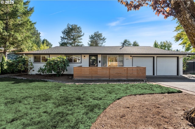 65 SW Frenwood Way, Beaverton, OR 97005 - single story home featuring an attached garage, concrete driveway, a front yard, stucco siding, and a shingled roof