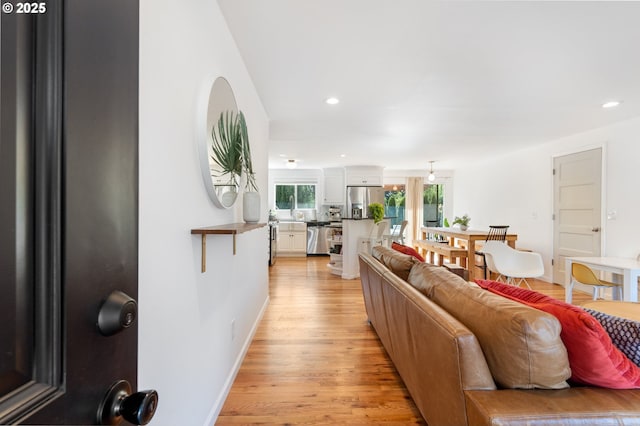 65 SW Frenwood Way, Beaverton, OR 97005 - living room featuring light wood-style floors and recessed lighting