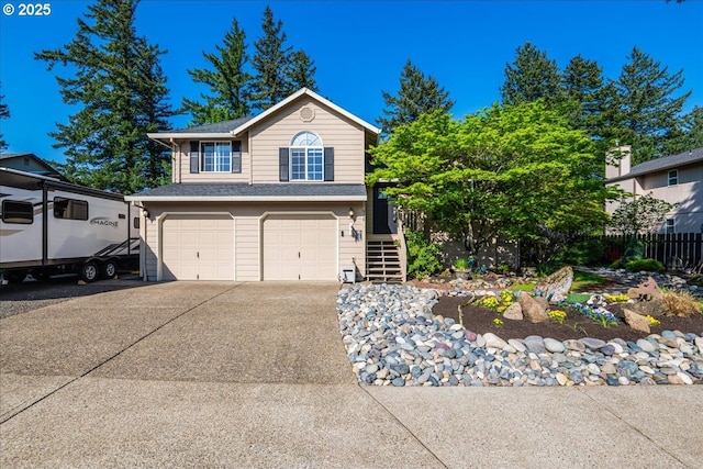 808 SE Beaver Creek Ln, Troutdale, OR 97060 - view of front of house featuring an attached garage, stairs, concrete driveway, and a shingled roof