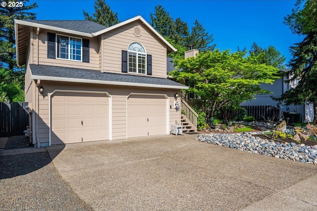 808 SE Beaver Creek Ln, Troutdale, OR 97060 - view of front facade with a garage, driveway, and a shingled roof