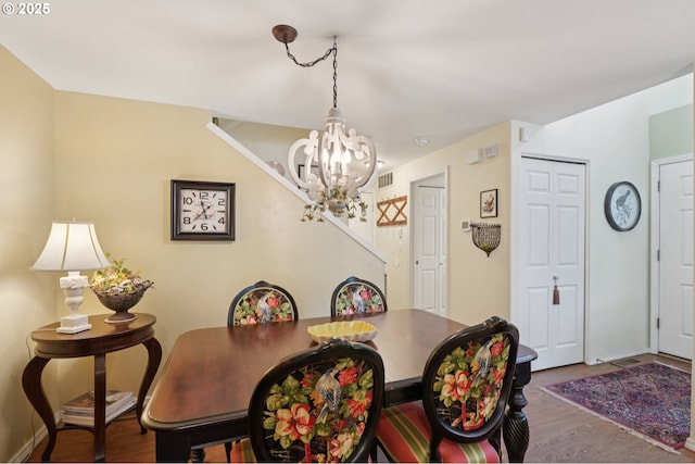 16199 SW Audubon St Unit 101, Beaverton, OR 97003 - dining room featuring a chandelier, wood finished floors, and baseboards
