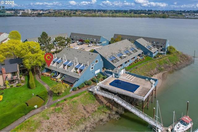 birds eye view of property featuring a water view and a residential view