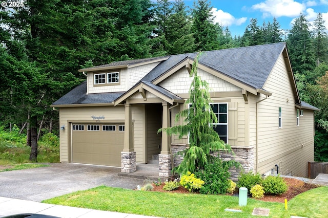 2314 SW 43rd St, Gresham, OR 97080 - craftsman-style home with driveway, a shingled roof, a garage, and a front lawn