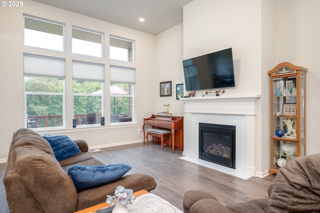 2314 SW 43rd St, Gresham, OR 97080 - living area with a fireplace with flush hearth, wood finished floors, a towering ceiling, and recessed lighting