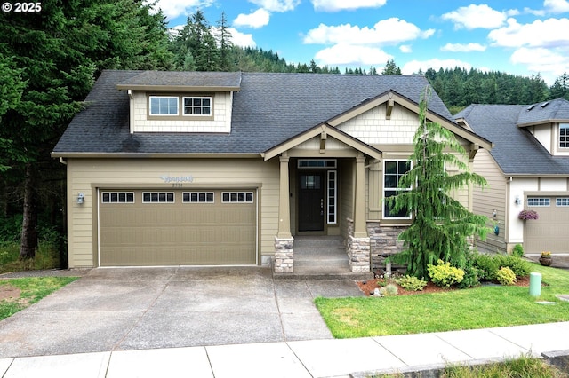 2314 SW 43rd St, Gresham, OR 97080 - craftsman-style house featuring concrete driveway, a shingled roof, stone siding, and a front lawn