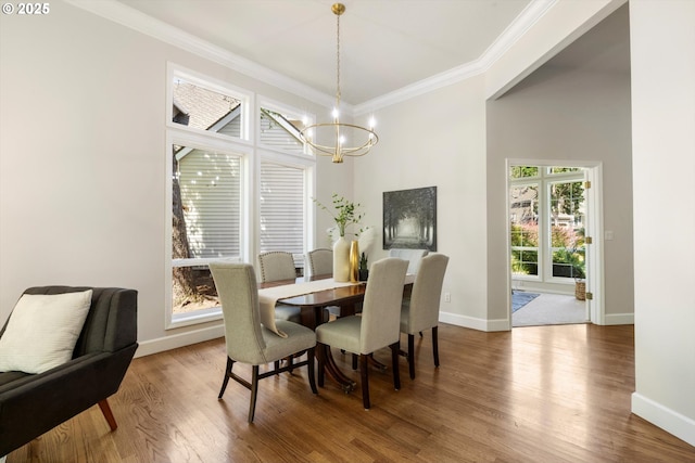 4698 Winthrop Ct, Lake Oswego, OR 97035 - dining room featuring a chandelier, ornamental molding, and wood finished floors