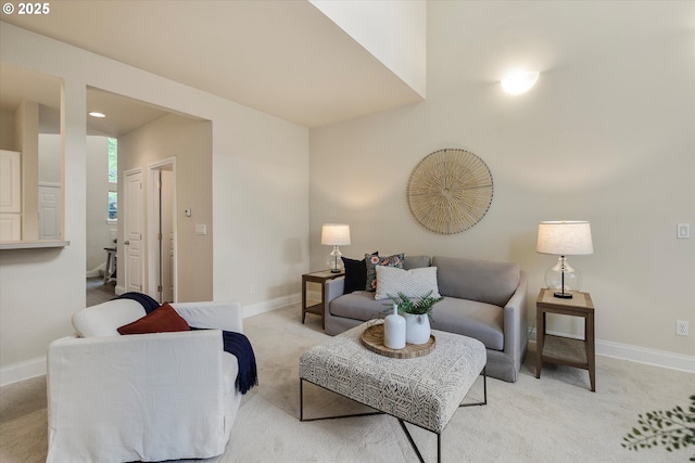 living room with light carpet and baseboards