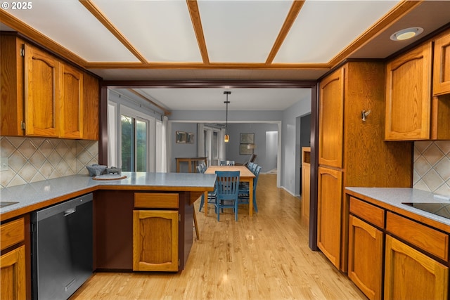 142 Lyons Rd, Stevenson, WA 98648 - kitchen featuring stainless steel dishwasher, brown cabinetry, and light wood finished floors