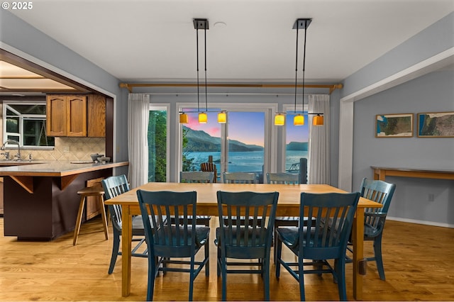 142 Lyons Rd, Stevenson, WA 98648 - dining area with light wood-type flooring and baseboards