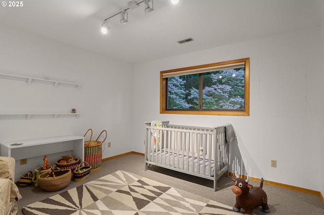142 Lyons Rd, Stevenson, WA 98648 - bedroom featuring carpet flooring, baseboards, and rail lighting