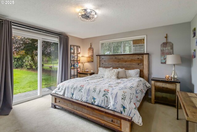 772 Elochoman Valley Rd, Cathlamet, WA 98612 - carpeted bedroom featuring access to exterior and a textured ceiling