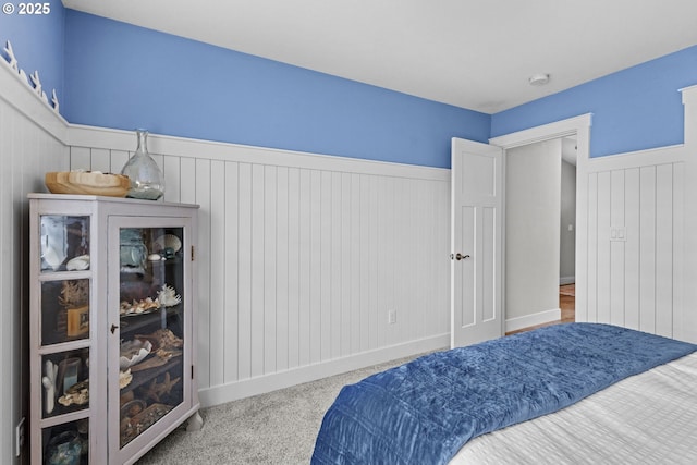 4635 Chaucer Ct, Depoe Bay, OR 97341 - bedroom with wainscoting and carpet floors