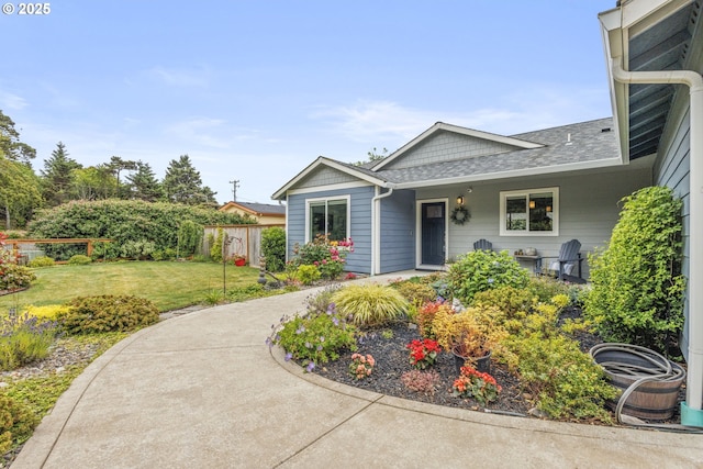 4635 Chaucer Ct, Depoe Bay, OR 97341 - view of front of property featuring a shingled roof and covered porch