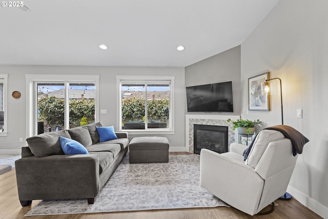 4635 Chaucer Ct, Depoe Bay, OR 97341 - living room with healthy amount of natural light, a fireplace, wood finished floors, and recessed lighting