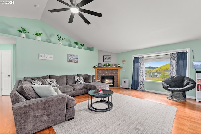 292 Jamie Loop, Roseburg, OR 97471 - living room featuring a ceiling fan, vaulted ceiling, a glass covered fireplace, and wood finished floors