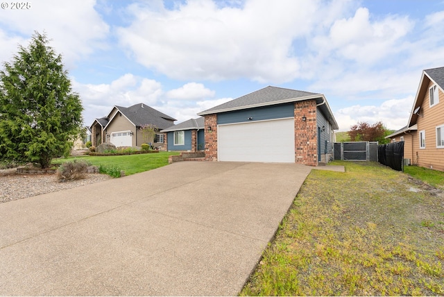 292 Jamie Loop, Roseburg, OR 97471 - ranch-style home featuring brick siding, driveway, an attached garage, and a residential view