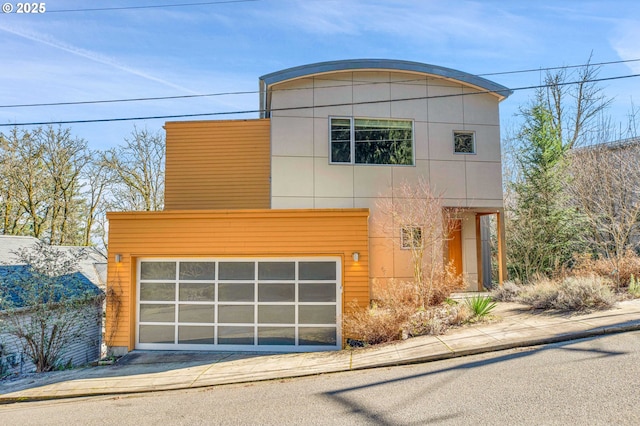 contemporary house featuring driveway and a garage