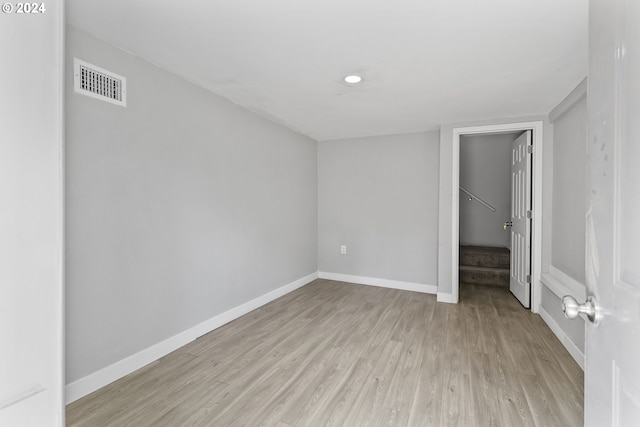 unfurnished bedroom with baseboards, visible vents, and light wood finished floors