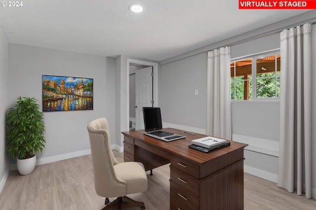 office space with light wood-type flooring, recessed lighting, and baseboards