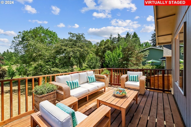 deck with an outdoor hangout area