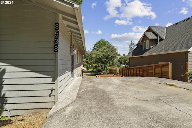 view of side of property with fence