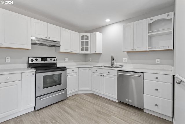 kitchen with open shelves, appliances with stainless steel finishes, a sink, recessed lighting, and under cabinet range hood