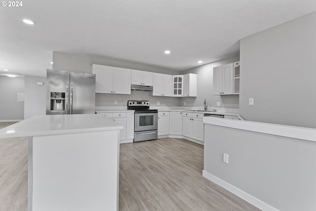 kitchen with appliances with stainless steel finishes, light wood-style floors, recessed lighting, baseboards, and under cabinet range hood