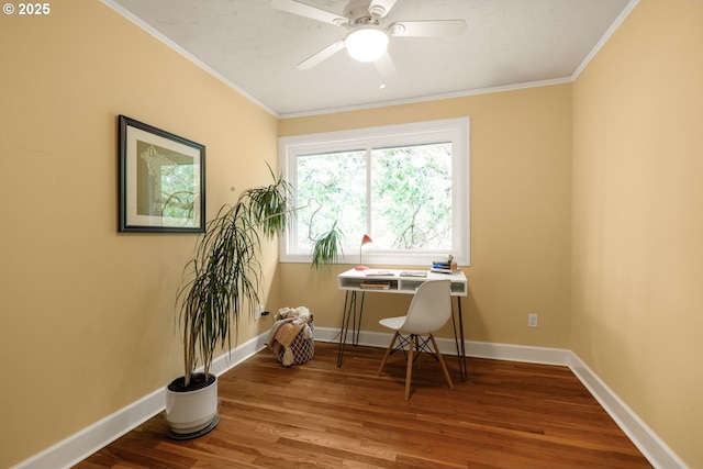 office featuring wood finished floors, crown molding, a ceiling fan, and baseboards