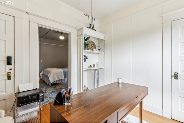 2058 NW Flanders St Unit 5-2, Portland, OR 97209 - kitchen featuring stainless steel dishwasher, black / electric stove, butcher block countertops, a sink, and open shelves