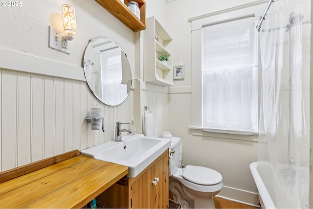 2058 NW Flanders St Unit 5-2, Portland, OR 97209 - kitchen with dishwasher, a sink, butcher block countertops, and healthy amount of natural light