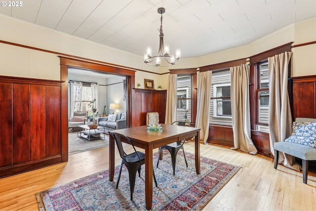 2058 NW Flanders St Unit 5-2, Portland, OR 97209 - living room featuring a chandelier and wood finished floors