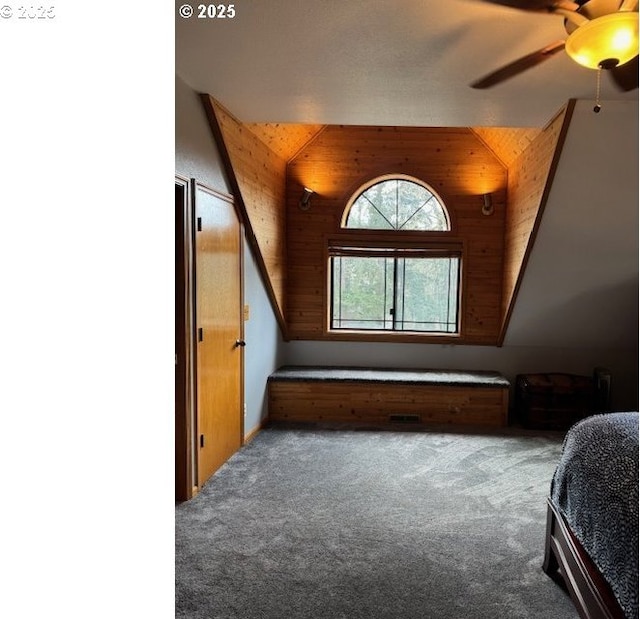 2703 Moon Mountain Dr, Eugene, OR 97403 - carpeted bedroom with ceiling fan and wood walls