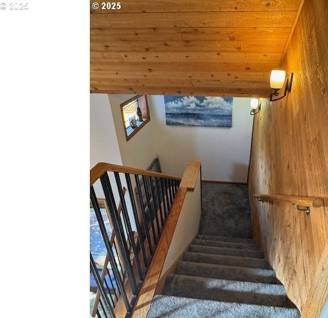 2703 Moon Mountain Dr, Eugene, OR 97403 - stairway featuring wooden walls, carpet, and wood ceiling