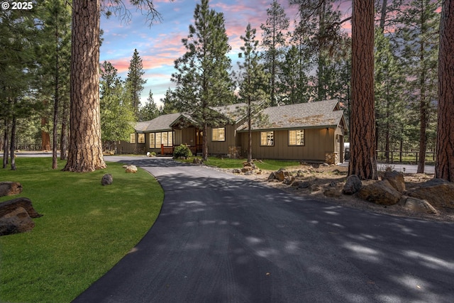 ranch-style house with a lawn