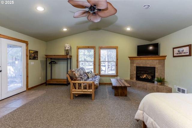 carpeted bedroom with a fireplace, ceiling fan, access to exterior, and lofted ceiling