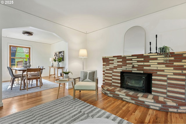 4650 NE Simpson St, Portland, OR 97218 - living area featuring a wood stove and wood finished floors