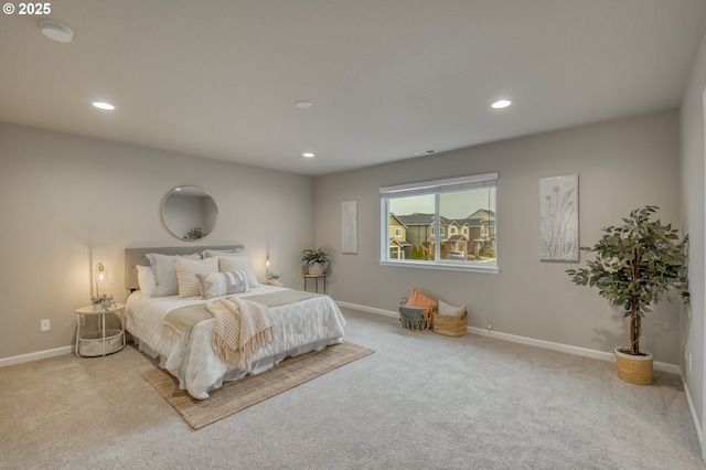 bedroom featuring light carpet, baseboards, and recessed lighting