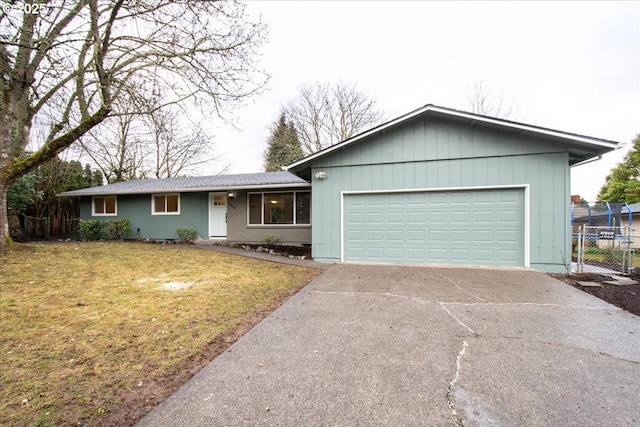 ranch-style house featuring concrete driveway, a front lawn, an attached garage, and fence