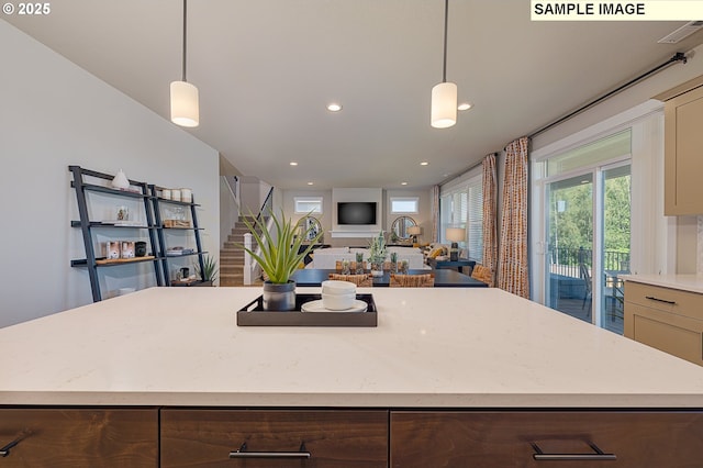 1449 NE Josephine Ct Unit 170, Estacada, OR 97023 - kitchen featuring a kitchen island, light stone counters, hanging light fixtures, and recessed lighting