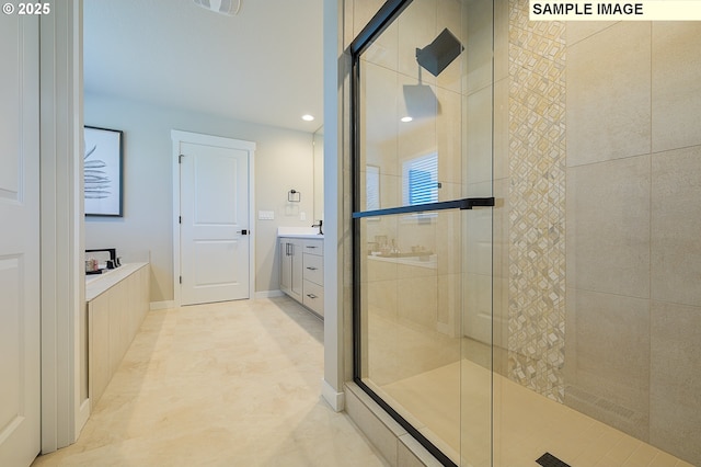 1449 NE Josephine Ct Unit 170, Estacada, OR 97023 - bathroom featuring tiled shower, a bath, vanity, baseboards, and recessed lighting