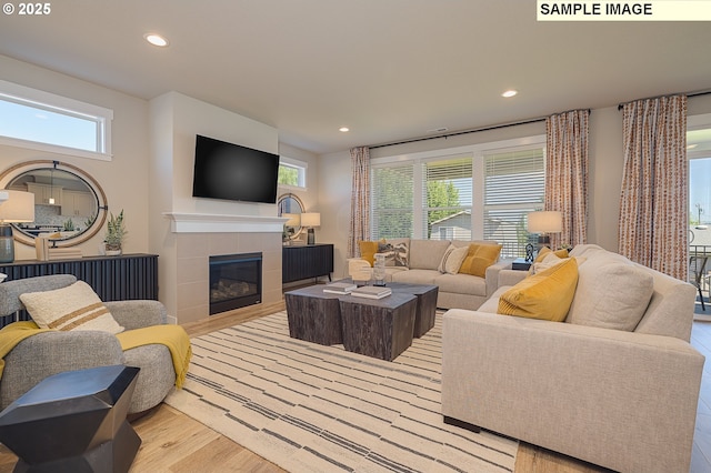 1449 NE Josephine Ct Unit 170, Estacada, OR 97023 - living room featuring recessed lighting, a tiled fireplace, and wood finished floors